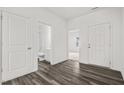 Welcoming entryway featuring hard surface floors, with views of bathroom and spare room at 805 Berkeley Glen Rd, Zebulon, NC 27597