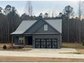 Charming single-story home featuring a two-car garage and a neatly kept front lawn at 945 Lynch Rd, Selma, NC 27576