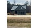 Charming single-story home featuring a two-car garage and a neatly kept front lawn at 945 Lynch Rd, Selma, NC 27576