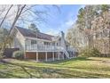 Back exterior view showcasing a raised deck that enhances outdoor living at 10 Eastwind Pl, Chapel Hill, NC 27517