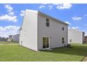 This home features a spacious backyard with a well-maintained lawn at 103 Shelfit Trl, Oxford, NC 27565