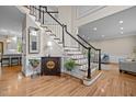 Elegant foyer with hardwood floors, staircase, and decorative accents at 105 Aberson Ct, Cary, NC 27519