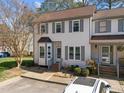 Charming townhome featuring neutral siding, gray shutters, and a delightful bay window at 12 Citation Dr, Durham, NC 27713