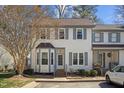 Charming townhome featuring neutral siding, gray shutters, and a delightful bay window at 12 Citation Dr, Durham, NC 27713