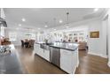 Open concept kitchen with stainless steel appliances and eat-in area, perfect for modern living at 131 English Violet Ln, Raleigh, NC 27610
