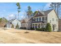 A beautiful home with a well-maintained lawn and landscaping and architectural details at 1328 Mill Glen Cir, Raleigh, NC 27614