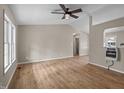 Bright living room featuring neutral paint, wood floors, and ceiling fan at 1723 Bahama Rd, Bahama, NC 27503