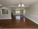 Spacious living room with hardwood floors, ample natural light, and open floor plan at 1816 Phillips Dr, Sanford, NC 27330
