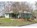 Cozy single-Gathering home with brick exterior, mature trees, and a well-manicured lawn at 1900 Sunset Ave, Durham, NC 27705