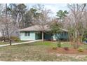 Charming single-Gathering home with a well-kept lawn, mature trees, and a welcoming front porch at 1900 Sunset Ave, Durham, NC 27705