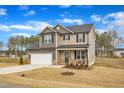 Lovely two-story home with a two-car garage and a well-kept lawn in a peaceful neighborhood at 252 Olde Place Dr, Zebulon, NC 27597