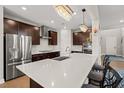 Modern kitchen features stainless steel appliances, a center island, and beautiful pendant lighting at 3356 Longleaf Estates Dr, Raleigh, NC 27616