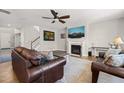 Comfortable living room with fireplace, ceiling fan, hardwood floors and neutral colors at 3356 Longleaf Estates Dr, Raleigh, NC 27616