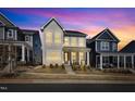 Sunset view of neighborhood homes showcasing their charming facades and inviting curb appeal at 372 Natsam Woods Way, Wake Forest, NC 27587