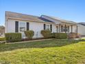 Inviting one-story home with a well-kept yard, classic design, and welcoming curb appeal at 4 Hannah Ct, Durham, NC 27713