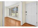 Bright entryway featuring hardwood floors and a large window that floods the space with natural light at 411 Colony Woods Dr, Chapel Hill, NC 27517