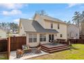 The house showcases a spacious deck and patio area, perfect for outdoor entertaining and relaxation at 6524 Caverstone Dr, Durham, NC 27713