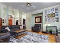 Inviting living room with hardwood floors, a ceiling fan, and neutral paint at 715 Thompson Rd, Garner, NC 27529