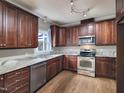Kitchen with stainless steel appliances, granite counters, and beautiful wood cabinets at 725 Littleleaf Ct, Holly Springs, NC 27540