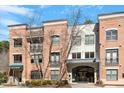 Elegant multi-story brick building with modern architectural details and well-maintained landscaping at 7250 Hwy 751 # 2109, Durham, NC 27707