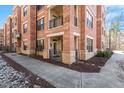 Charming brick exterior with a private entrance and walkway, framed by stone accents and landscaping at 7250 Hwy 751 # 2109, Durham, NC 27707