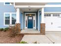 A close-up of the front door featuring brick pillars and the address number above the entryway at 741 Moonbeam Dr, Raleigh, NC 27603