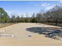 Well-maintained equestrian arena, ideal for training and riding, featuring a spacious sand surface at 8809 Farrington Mill Rd, Chapel Hill, NC 27517