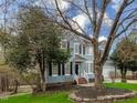 Inviting two-story home with mature trees, blue siding, and a well-maintained front yard at 104 Deep Gap Run, Cary, NC 27519