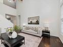 Bright living room with high ceilings, a comfortable sofa, and modern decor at 104 Deep Gap Run, Cary, NC 27519
