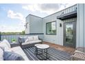 Outdoor patio features a modern sitting area with views, perfect for entertaining at 2002 Moody Ln, Durham, NC 27701