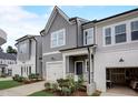 Charming two-story home with a gray siding, a garage, and beautifully landscaped front yard at 2003 Regal Dr # 90, Durham, NC 27703
