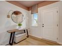 Bright foyer featuring a stylish mirror, console table, and elegant lighting fixtures at 2003 Regal Dr # 90, Durham, NC 27703