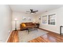 Inviting living room with hardwood floors, ceiling fan, and lots of natural light at 2409 Keith Dr, Raleigh, NC 27610