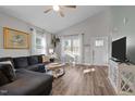 Bright living room with vaulted ceiling, ceiling fan, neutral walls, and lots of natural light at 310 Chub Lake St, Roxboro, NC 27573