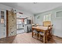 Dining room with table, chairs and pass through to fixer upper kitchen, needing maintenance at 3528 Cheek Rd, Durham, NC 27704