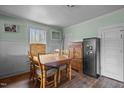 Dining room featuring table, chairs, and windows with natural light in a fixer upper home needing maintenance at 3528 Cheek Rd, Durham, NC 27704