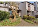 Charming townhouse showcasing beautiful landscaping and a welcoming entrance at 3775 Guess Rd # 36, Durham, NC 27705