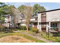 Inviting condo exterior with lush landscaping and a welcoming walkway at 3775 Guess Rd # 36, Durham, NC 27705