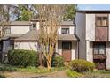 Exterior view of a charming townhouse with manicured landscaping at 3775 Guess Rd # 36, Durham, NC 27705