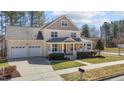 Elevated view of a delightful two-story home featuring an attached two-car garage and inviting front porch at 400 Oxford Park Blvd, Oxford, NC 27565