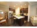 Modern kitchen with granite countertops, stainless steel appliances, and a center island at 420 Retreat Ln, Wake Forest, NC 27587