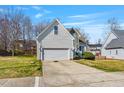 Charming two-story home featuring stone accents, manicured landscaping, and a two-car garage at 4429 Gallatree Ln, Raleigh, NC 27616