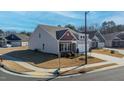 Corner lot featuring a charming home with a two-car garage and well-kept lawn at 1 Parker Pond Ct, Durham, NC 27703