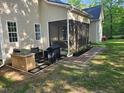 The backyard features a patio and a screened-in porch, perfect for outdoor entertaining and relaxation at 10 Holden Ct, Youngsville, NC 27596