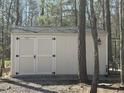 A backyard shed offers practical storage solutions for tools and equipment, enhancing the property's functionality at 10 Holden Ct, Youngsville, NC 27596