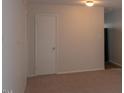 Neutral living room featuring neutral carpet, neutral colored walls, ceiling light and interior doors at 108 Ephesus Church Rd # Apt 512, Chapel Hill, NC 27517