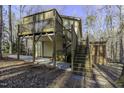 Expansive backyard with large deck, lower-level patio, and private wooded surroundings at 1121 Tallyho Trl, Chapel Hill, NC 27516