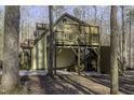 Outdoor space with multi-level deck and patio, perfect for enjoying nature at 1121 Tallyho Trl, Chapel Hill, NC 27516