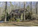 Exterior of a charming home with a two-story deck perfect for outdoor entertaining at 1121 Tallyho Trl, Chapel Hill, NC 27516