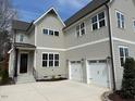 Charming home featuring an attached two-car garage and classic architectural details at 12912 Grey Willow Dr, Raleigh, NC 27613